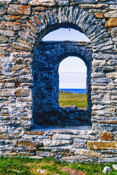 istock Old church ruin with a sea view through the windows 1679740698