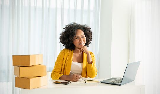 Portrait beautiful  SME business black woman smiling positive, Business lifestyle, confident owner casual girl, startup small sme online business job. Success freelance woman work at home office desk