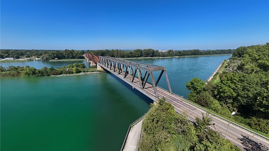 A scenic view of the Wintersdorf bridge spanning the Rhine River between Germany and France
