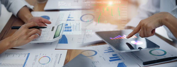istock Group of  business hands with business financial documents. 1679771332