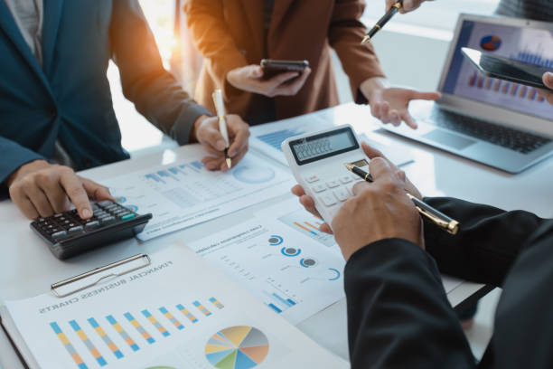 istock Group of  business hands with business financial documents. 1679771876