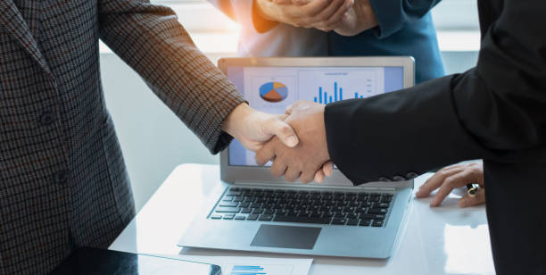 istock Group of  business handshake with business financial documents. 1679771883