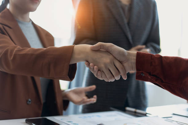 istock Group of  business handshake with business financial documents. 1679771886