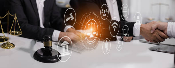 istock Lawyer hands using digital smartphone with law network interface icons. 1679775117