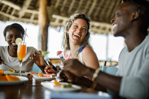 istock Cheerful friends talking during their lunch at a restaurant. 1679783348