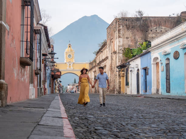 They travel and visit the old town of Antigua, Central America exploration.