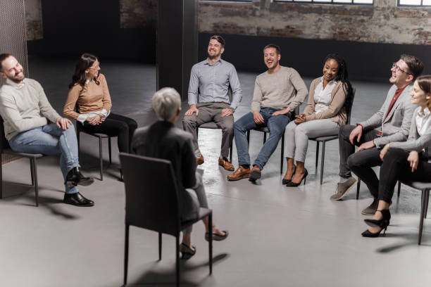 istock Cheerful entrepreneurs laughing during a group therapy in the office. 1679796051