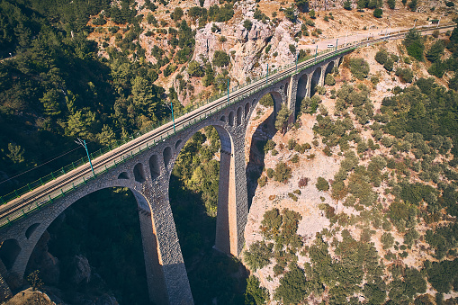 Varda railway bridge also known as German bridge. Adana province, Turkiye. Stone viaduct built by German engineers and Turkish workers in 19 century. Aerial view