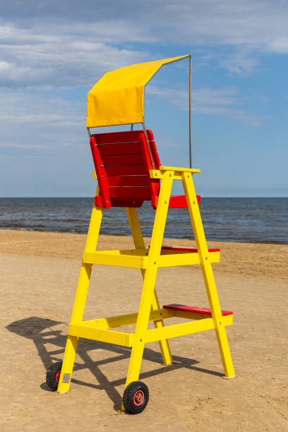 istock Empty lifeguard chair on the sea beach. 1679818780