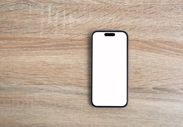 istock Mobile phone on the wooden floor. 1679821502