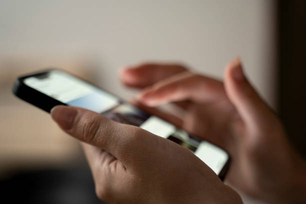 istock Hand holding smartphone, demonstrating digital communication and wireless technology. 1679828694
