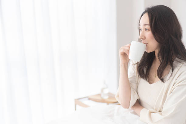 istock A woman is drinking a drink. 1679844010