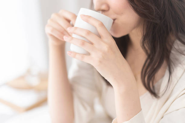 istock A woman is drinking a drink. 1679844028