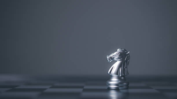 istock Silver horse chess encounters. Chess board game, business competitive. Business competitor concept. 1679848785