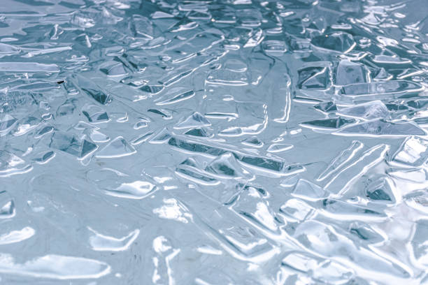 Cold water and ice cubes melting background. Global warming or climate change concept. Cold therapy, breathing techniques, Wim Hof Method, yoga and meditation