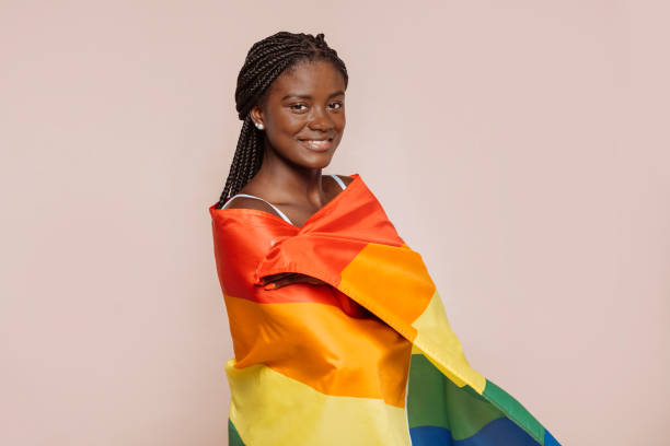 istock African female with rainbow flag 1679901427