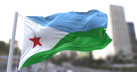 Bandera nacional de Djibouti ondeando en el viento. photo