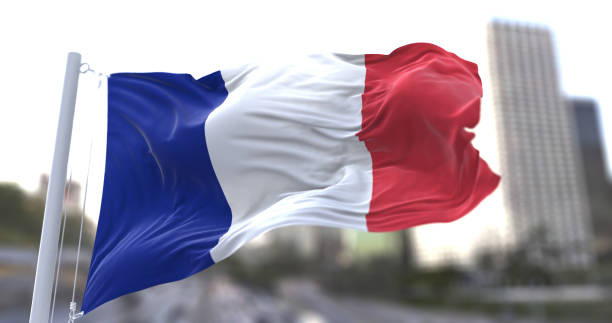 istock France National flag waving in the wind. 1679933275
