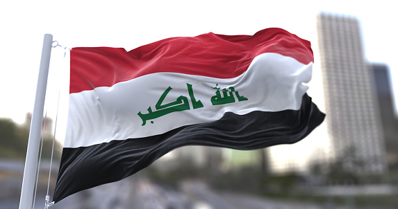 Syrian flag waving on a green background. Horizontal composition with copy space.