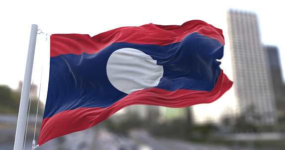 3d illustration flag of Laos. Laos flag isolated on the sky waving in the wind.