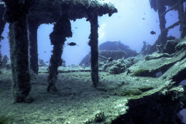 istock Shipwreck in the Blue Water, Rusty Shipwreck with Growing Corals 1679961418