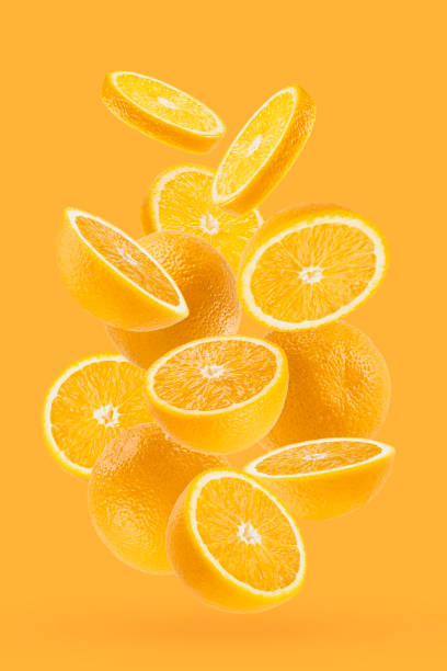istock Bright oranges closeup levitation as flow, art composition. Whole, half, round slices fruits on pastel orange background, shadow. Summer fruits for advertising, design, label product, poster, card. 1679976244
