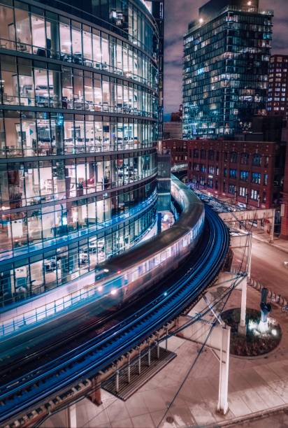 istock Kenzie - Wells Elevated L Train in Chicago at night 1679994918