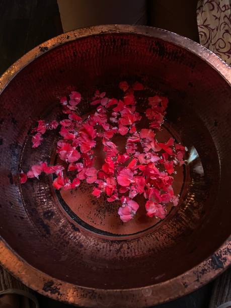 istock Foot bath worth beautiful rose. 1679998696