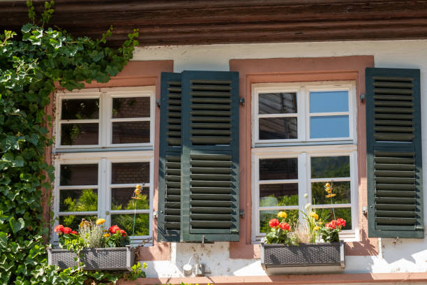 istock window with shutters and summer decoration 1679999312