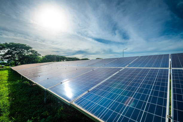istock Photovoltaic solar power panel on dramatic sunset blue sky background, green clean Alternative power energy concept. 1680006101