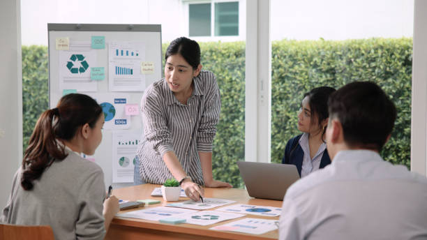 istock Carbon offset price report CO2 emission. Future growth Net zero waste in ESG ethical SME office protect climate change global warming social issues project. Group of asia people Eco friendly SDGs plan 1680075603