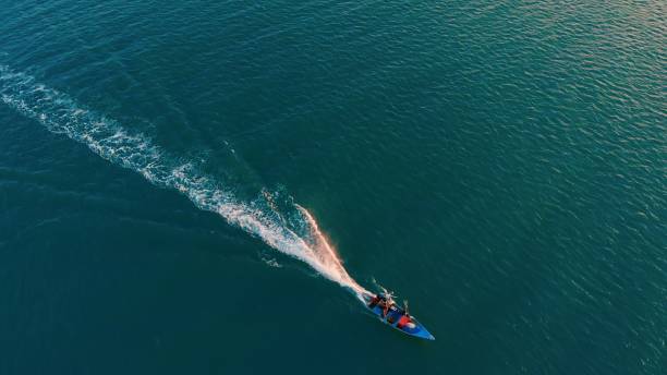 White path on water from ship on ocean surface in Guatemala. top view of ship foaming wake trail on turquoise alluring ocean. Real shot of ship wake trail on Guatemala's ocean. Visit Guatemala.