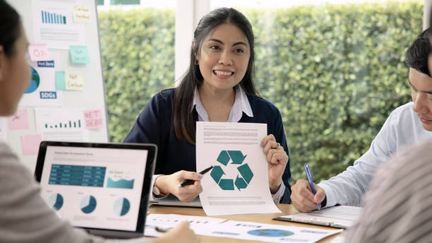 istock Carbon offset price report CO2 emission. Future growth Net zero waste in ESG ethical SME office protect climate change global warming social issues project. Group of asia people Eco friendly SDGs plan 1680083635