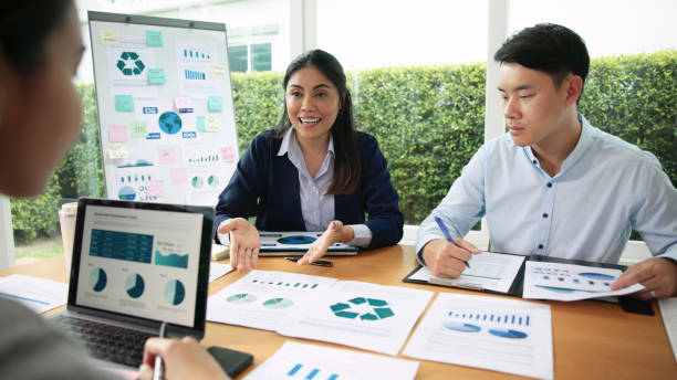 istock Carbon offset price report CO2 emission. Future growth Net zero waste in ESG ethical SME office protect climate change global warming social issues project. Group of asia people Eco friendly SDGs plan 1680090522
