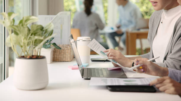 Save the planet earth of Future growth Net zero waste ESG office global protect CO2 credit emission social issues project. Asia people woman teamwork teaching advice Eco friendly SDGs job on laptop.