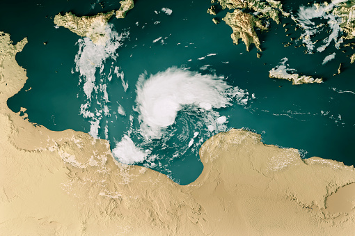 3D Render of a Topographic Map of the Mediterranean Sea near Libya with the clouds from September 09, 2023. 
Subtropical Storm Daniel north of Libya.
All source data is in the public domain.
Cloud texture: Global Imagery Browse Services (GIBS) courtesy of NASA, VIIRS data courtesy of NOAA.
https://www.earthdata.nasa.gov/eosdis/science-system-description/eosdis-components/gibs
Color texture: Made with Natural Earth.
http://www.naturalearthdata.com/downloads/10m-raster-data/10m-cross-blend-hypso/
Relief texture: GMTED 2010 data courtesy of USGS. URL of source image:
https://topotools.cr.usgs.gov/gmted_viewer/viewer.htm
Water texture: SRTM Water Body SWDB: https://dds.cr.usgs.gov/srtm/version2_1/SWBD/