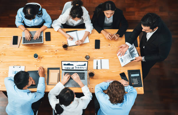 istock Panorama top view diverse analyst team analyzing financial data. Habiliment 1680116560