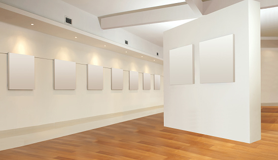 Art gallery hall with empty frame on wall