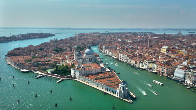 Aerial view of Venice Italy, drone shot of Venetian architecture and canal, aerial view of Santa Maria della Salute, aerial drone scene of Piazza San Marco with the Basilica and Campanile