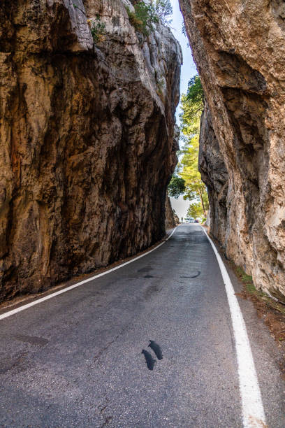 Mountain road in Cala Tuent, Majorca, Spain. Narrow street near torrent di Pareis