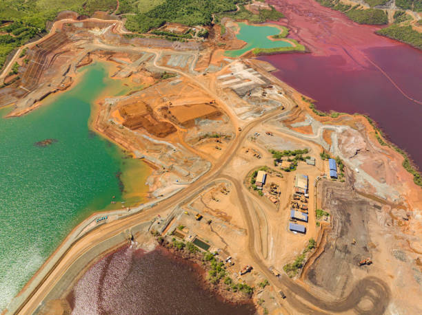 Quarry truck of nickel and heavy equipment. Mining in an open pit. Mindanao, Philippines.