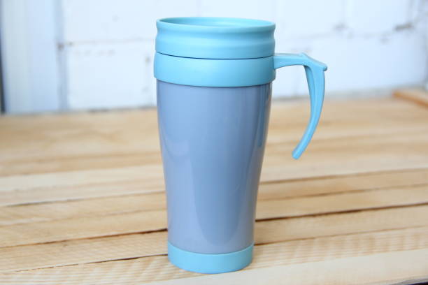 istock Blue thermo mug on wooden background 1680143565