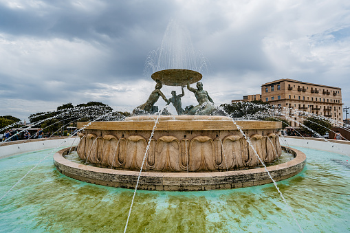 White fountain in the garden.