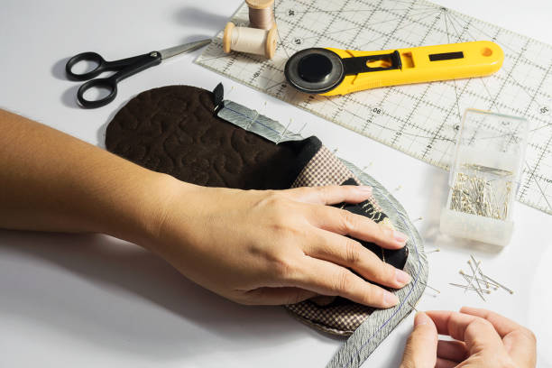 istock Lady is making handmade cloth soft shoe 1680182897