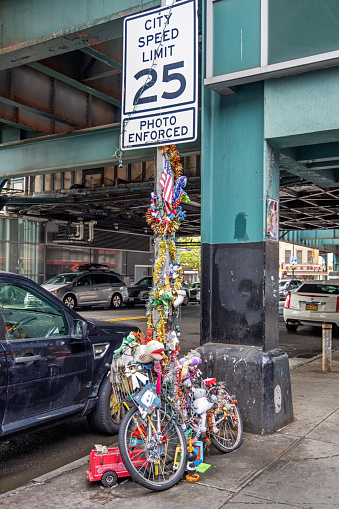 Court Square, Long Island City, Queens, New York, USA - August 13th 2023:  Memorial for the victim of a traffic accident under the elevated subway