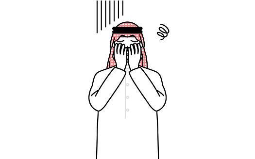 Senior Muslim Man covering his face in depression.