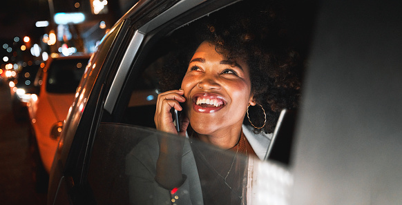 Travel, transportation and night, black woman and phone call, city view and communication with drive and smile on face. Car, adventure and happiness, technology with conversation on mobile and urban