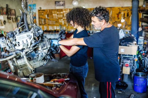istock Man teaches his son car mechanics 1680228546