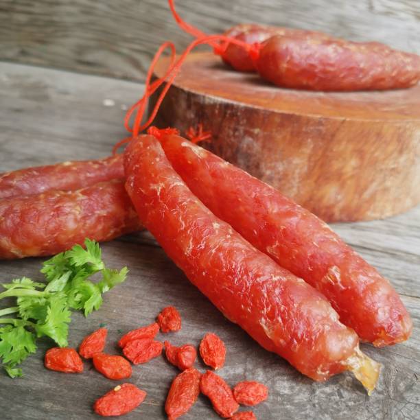 istock Chinese sausage pork on wood background 1680230495