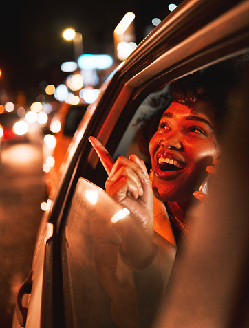 Happy black woman, phone call and travel at night in city taxi, communication or networking. Excited African female person smile in conversation or late evening discussion on mobile smartphone in car